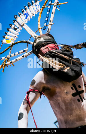 Apache man dancing in traditional regalia Stock Photo