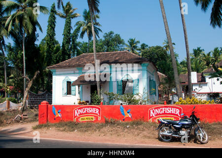 Colonial house with Kingfisher beer advertising Goa India Stock Photo
