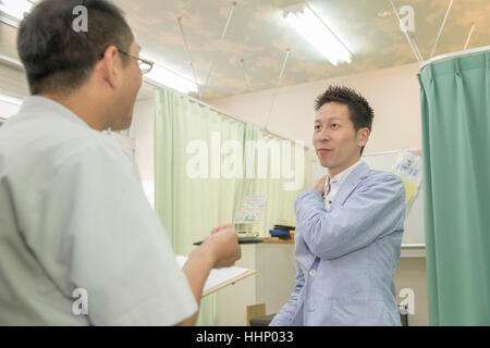 Man Seeing Doctor Stock Photo