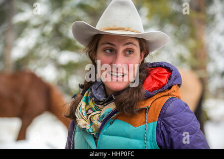 Smiling Caucasian woman in winter Stock Photo