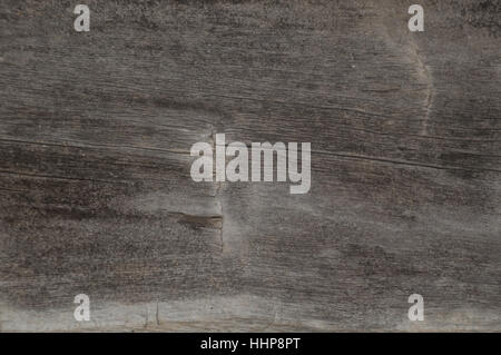Old log cabin wood timber closeup with wood grain and adze marks. Background Stock Photo