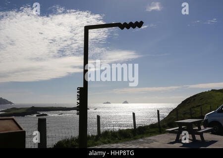 The Wild Atlantic Way marker at Bray Head on Valentia Island, County Kerry, Ireland. The Skelligs are on the horizon. Stock Photo
