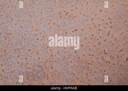 Rusty pitted background surface of a rural farm implement Stock Photo