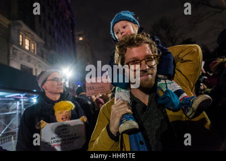 New York, USA. 19th January 2017. On the eve of the presidential inauguration thousands of New Yorkers rallied on Central Park West to protest against the inauguration of Donald Trump. The rally, called for by Michael Moore, Alec Baldwin, Al Sharpton, Rosy Perez and New York City Mayor Bill de Blasio, stretched from Columbus Circle to West 67th Street. Those who were too far away watched a live broadcast on their smart phones. © Stacy Walsh Rosenstock/Alamy Live News Stock Photo