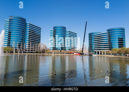 Oracle Corporation headquarters / buildings with a Oracle Team USA yacht racing boat in a pool at Redwood Shores, California Stock Photo