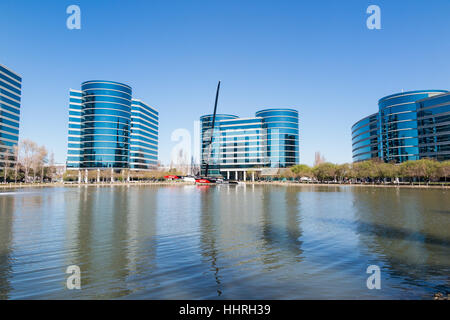 Oracle Corporation headquarters / buildings with a Oracle Team USA yacht racing boat in a pool at Redwood Shores, California Stock Photo