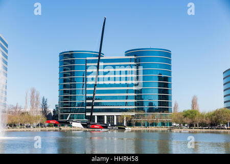 Oracle Corporation headquarters / buildings with a Oracle Team USA yacht racing boat in a pool at Redwood Shores, California Stock Photo