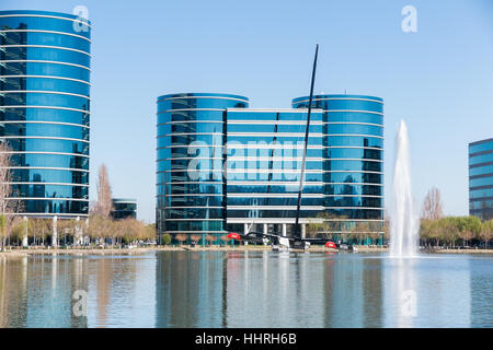 Oracle Corporation headquarters / buildings with a Oracle Team USA yacht racing boat in a pool at Redwood Shores, California Stock Photo