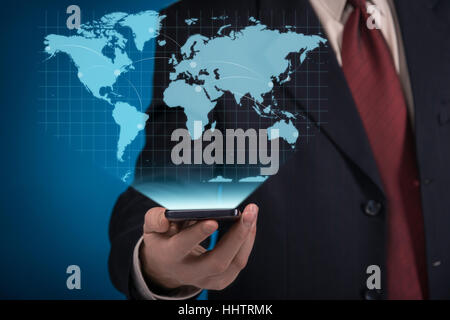 Businessman using virtual screen with world map Stock Photo