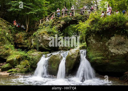 Bridge over the Schiessentumpel waterfall, near Waldbillig, Mullerthal Trail, Luxembourg. Stock Photo
