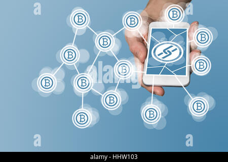Blockchain and bitcoin concept with hand holding modern smart phone as example for fin tech technology Stock Photo