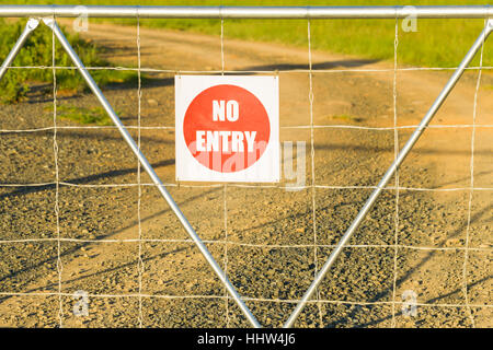 Farm gate closeup sign no entry private property closeup photo. Stock Photo