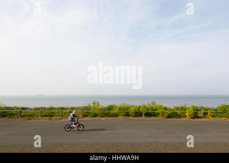 Botany Bay, Margate, Kent. A young boy riding a small BMX bike along a seaside path. Stock Photo