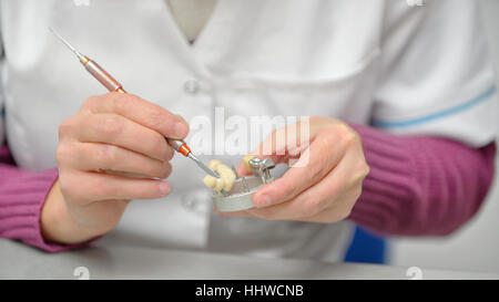 Closeup of dental technician working Stock Photo