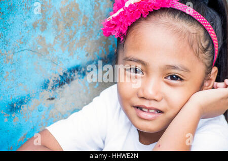 Small girl in slum by Bangkerohan River, Davao, Davao Del Sur, Philippines Stock Photo