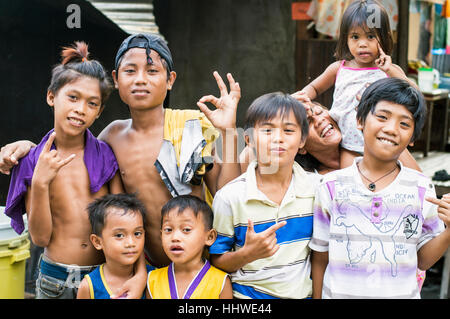 Children in slum by Bangkerohan River, Davao, Davao Del Sur, Philippines Stock Photo