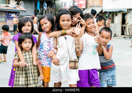 Children in slum by Bangkerohan River, Davao, Davao Del Sur, Philippines Stock Photo