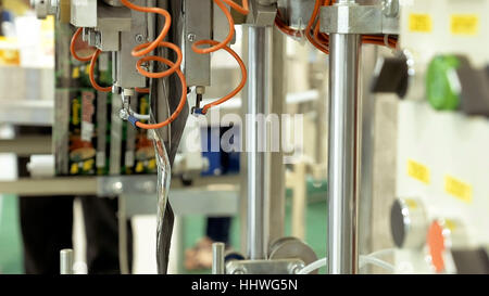 Food factory packing machine with pipes and rolls Stock Photo