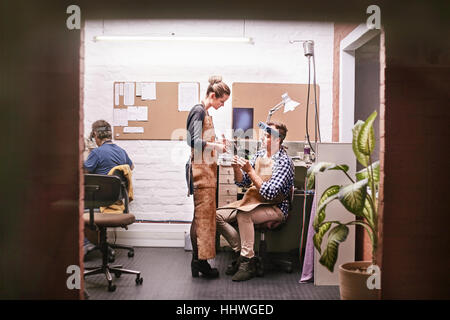 Jewelers talking in workshop office Stock Photo