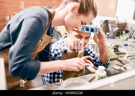 Jewelers working in workshop Stock Photo