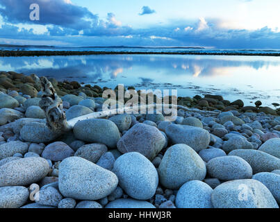 Granite stones on coast, large, round, cloudy sky, Bloody Foreland, Gweedore, Donegal County, Ireland Stock Photo