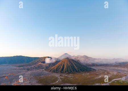 Sunrise, smoking Mount Bromo, Mt. Batok at front, Mt. Kursi at back, Mt. Gunung Semeru, morning atmosphere, Bromo Tengger Semeru Stock Photo