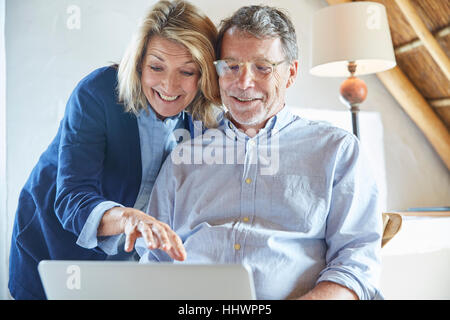 Senior couple using laptop Stock Photo