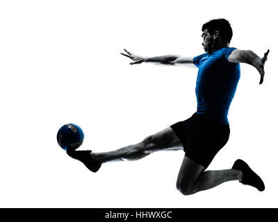 one caucasian man flying kicking playing soccer football player silhouette  in studio isolated on white background Stock Photo