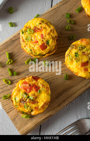 Homemade Healthy Breakfast Egg Muffins with Chives and Tomato Stock Photo