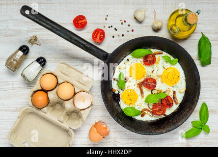 Cooking ingredients and Fried Eggs in pan. Stock Photo