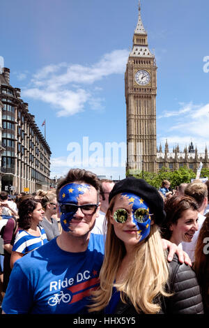 Man and woman with divided European union flag painted on their faces. Big Ben can be seen in background. Stock Photo