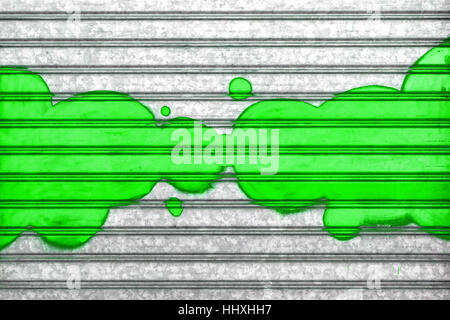 Green bubbles painted with spray paint on a roller shutter.  It can be used as a poster, wallpaper, design t-shirts and more. Fully editable. Stock Photo