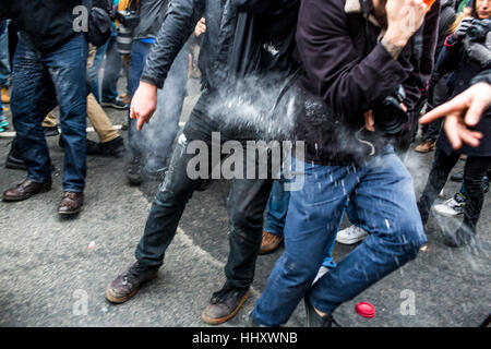Washington, USA. 20th Jan, 2017. Hours after Donald Trump was inaugurated as the 45th President of the United States, protesters clashed with riot police, who reportedly were targeted the groins of protestors and launched flash grenades into the packed streets. Credit: PACIFIC PRESS/Alamy Live News
