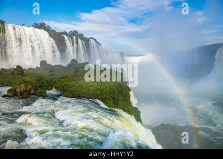 Close view of one of the Cataratas water falls under blue sky and a lot of water mist in the air at the Foz do Iguassu park, Brazil. Stock Photo