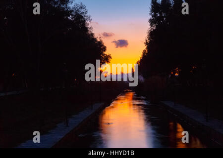 River reflections against a setting sun in the afternoon in Greece Stock Photo
