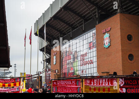 Fans weave past one another on Walton Breck Road in Liverpool prior to their home Premier League match against Swansea. Stock Photo