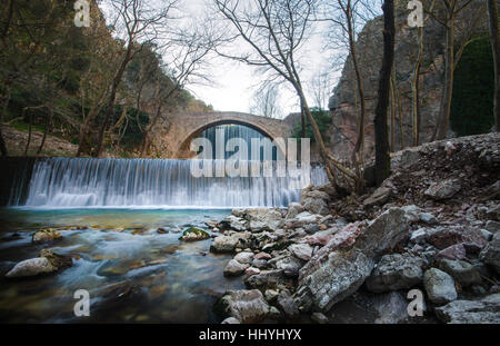 Paleokarya, old, stone, arched bridge, between two waterfalls. Trikala prefecture, Thessaly, Greece Stock Photo