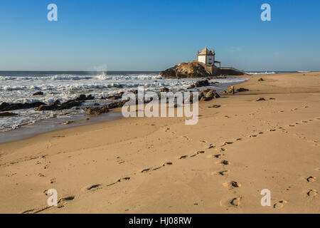 Miramar Beach (Praia de Miramar) and chapel Senhor da Pedra, near Porto, Portugal. Stock Photo