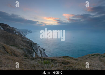View from White Nothe, Dorset, UK. A bitterly cold sunrise looking east along the Purbeck Jurassic Coastline from high up on White Nothe in Dorset. © Dan Tucker/Alamy Live News Stock Photo
