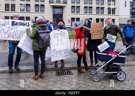 Berlin, Germany, 21st January 2017. Women, Men and Children gathered at the Pariser Platz outside the US Embassy today to protest against the newly inaugurated President, Donald Trump. Protests planned in London, Berlin, Oslo, Toronto and other cities around the world, will express the fear that Donald Trump poses a threat to human and civil rights. Eden Breitz/Alamy Live News Stock Photo