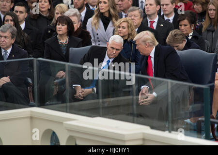 Washington, USA. 20th Jan, 2017.US President Donald Trump speaks to US Vice President Mike Pence during the inauguration ceremony at the U.S. Capitol in Washington, DC, the United States, on Jan. 20, 2017. Donald Trump was sworn in on Friday as the 45th President of the United States. Credit: charlie archambault/Alamy Live News Stock Photo
