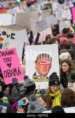 Washington, USA. 21st Jan, 2017.Demonstrators wave signs during the Women's March on Washington in protest to President Donald Trump in Washington, DC. More than 500,000 people crammed the National Mall in a peaceful and festival rally in a rebuke of the new president. Credit: Planetpix/Alamy Live News