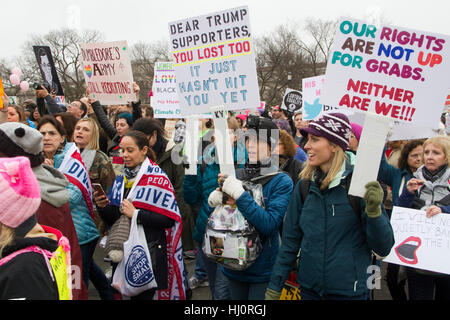 Washington DC, USA. 21st January, 2017. People take part in the Million Woman March one day after the Trump inauguration in Washington DC. An estimated half-million people packed the streets of Washington for a Saturday rally against President Trump, with the angry turnout doubling that of his inauguration. Credit: PixelPro/Alamy Live News Stock Photo