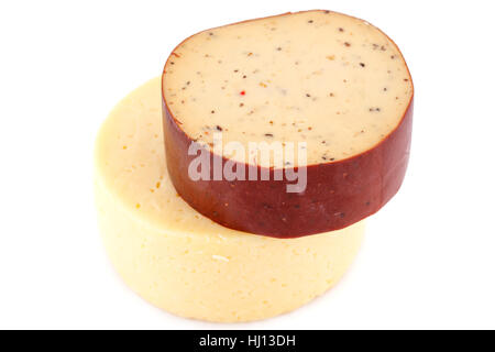 Two pieces of round cheese isolated on white background. Stock Photo