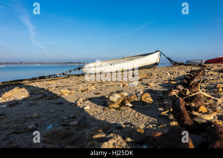 small rowing boat on beach River Stour estuary Stock Photo