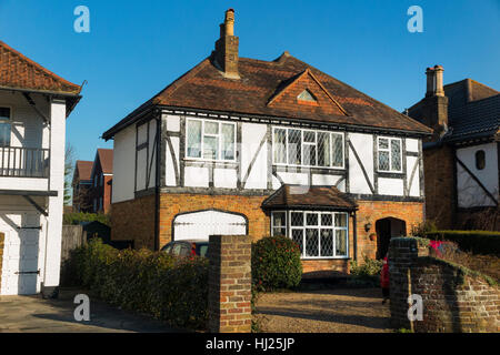 Mock Tudor 1930's house on a sunny day with blue sky / sun / blue skies in Esher, Surrey. UK. Stock Photo