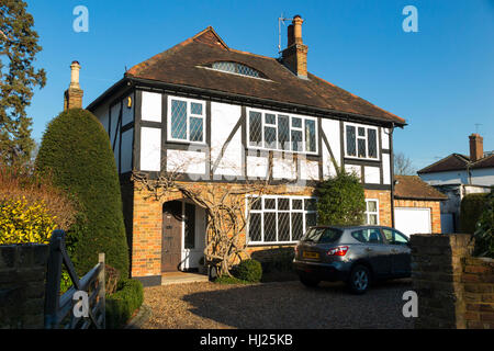Mock Tudor 1930's house on a sunny day with blue sky / sun / blue skies in Esher, Surrey. UK. Stock Photo
