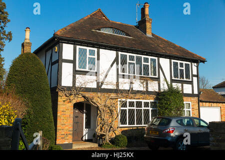 Mock Tudor 1930's house on a sunny day with blue sky / sun / blue skies in Esher, Surrey. UK. Stock Photo
