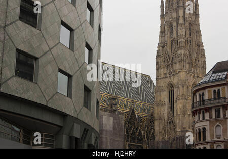 VIENNA, AUSTRIA - JANUARY 3 2016: Architectural close up of Haas Haus building and Stephansdom cathedral in Vienna, detail with no people Stock Photo