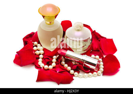 Perfume and pearl necklace in rose petals isolated on white. Stock Photo